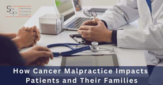 Hands of patient and doctor at a desk