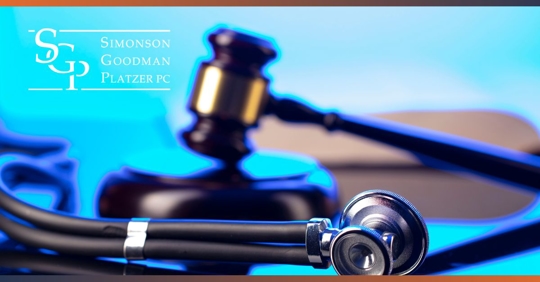 Stethoscope and lawyer statue